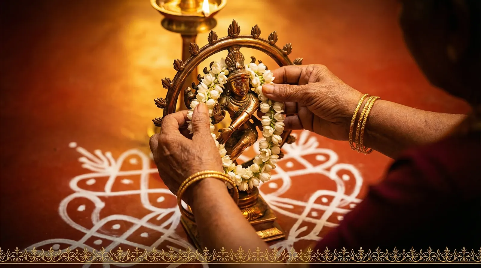 South Indian grandmother teaching a child anjali mudra before a bronze Nataraja